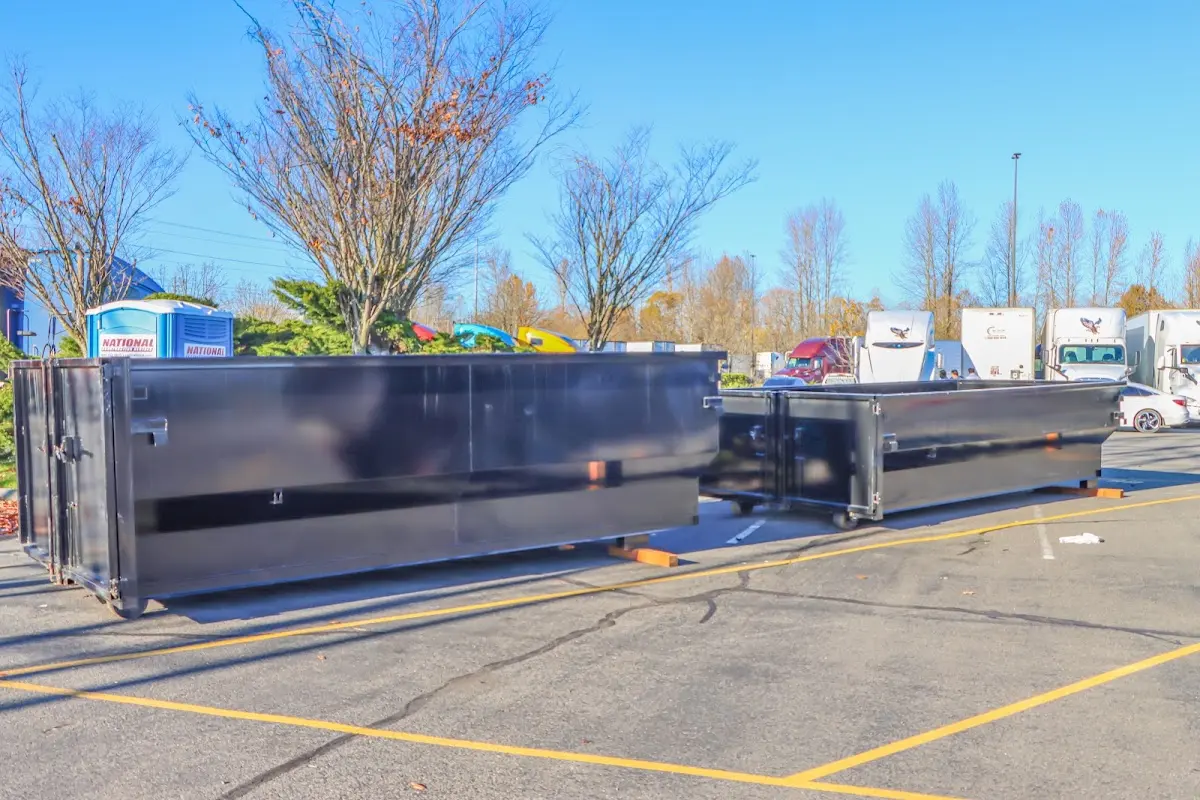 Professional dumpster rental service with roll-off container on residential driveway in Lynnwood